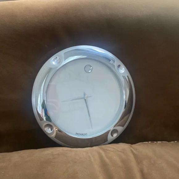 silver movado clock wall